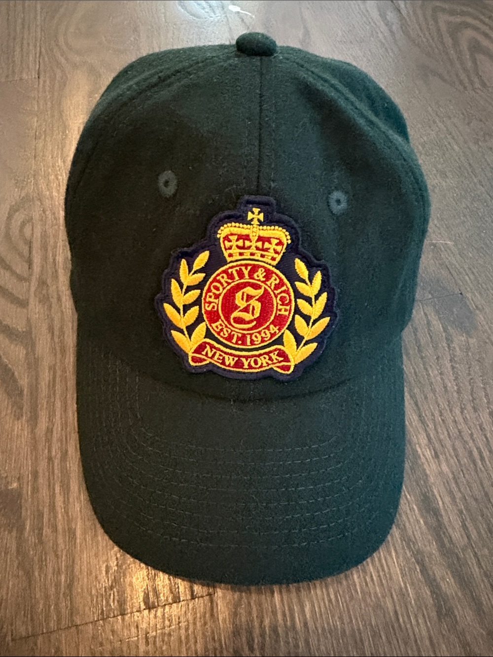 Sporty & Rich Dark Green Baseball Cap with Yellow and Red Crest